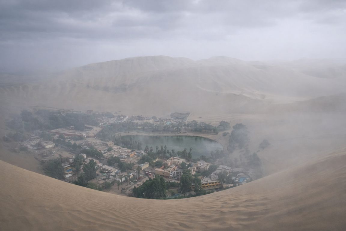 Morning garúa fog over Huacachina lagoon experienced during Huacachina Tours adventure